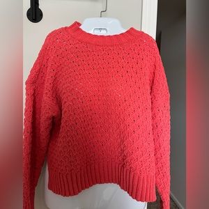 Cropped knit sweater.